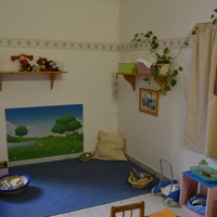 [Soft corner prepared to encourage free movement and sensory exploration of objects, Montessori Micronido run by the ONM in agreement with the Municipality of Rome, Via Nomentana 56, first decade of the 2000s] – ONM Archive.$$$526