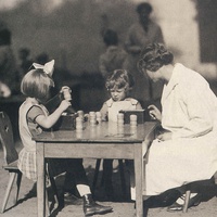 Children and their teacher working with the sound boxes. Children's House at the Fröbelseminar in Hamburg, around 1930 - T. Müller, R. Schneider, <em>Lehrmaterialien 1913-1935. Möbel und Architektur. Techning Meterials 1913-1935. Furniture and Architecture</em>, München, Prestel Verlag, 2002, p.88$$$445