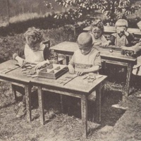 Lavori all'aperto Scene in the garden of a Children's House, Berlin-Lankwitz, 1919-22. Postcard published by the DMG (German Montessori Society), around 1927 - T. Müller, R. Schneider, <em>Lehrmaterialien 1913-1935. Möbel und Architektur. Techning Meterials 1913-1935. Furniture and Architecture</em>, München, Prestel Verlag, 2002, p.33.$$$373