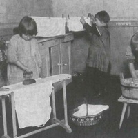 Boys and girls washing and ironing small items of laundry. Children's House, Leopoldplatz, Berlin-Wedding, around 1927 - T. Müller, R. Schneider, <em>Lehrmaterialien 1913-1935. Möbel und Architektur. Techning Meterials 1913-1935. Furniture and Architecture</em>, München, Prestel Verlag, 2002, p.79$$$413