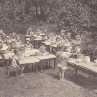 Pranzo all'aria aperta Lunch in the garden of one of the Berlin Children's Houses. Small "waiters" going about their work. Postcard published by the DMG (German Montessori Society), around 1927 with the inscription: "If, when creating an environment for the child, care is taken to make it suitable to his nature, he will from an early age prove to be a social being, willing to attend to the welfare of others." Photograph: Clara Grunwald - T. Müller, R. Schneider, <em>Lehrmaterialien 1913-1935. Möbel und Architektur. Techning Meterials 1913-1935. Furniture and Architecture</em>, München, Prestel Verlag, 2002, p.82$$$428