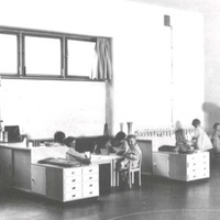 On the long sides of the activity room, low cupboards have been used to create bays, which the children use as work areas. On the right of the picture, the housekeeping niche can be seen [Montessori Children's House on Koldingsstrasse in Altona, 1928] - T. Müller, R. Schneider, <em>Lehrmaterialien 1913-1935. Möbel und Architektur. Techning Meterials 1913-1935. Furniture and Architecture</em>, München, Prestel Verlag, 2002, p.67$$$392