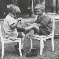 Aiuto reciproco nel vestirsi Children helping each other with getting dressed and fastening shoes. Children's House, Leopold-platz, Berlin-Wedding 1928 - T. Müller, R. Schneider, <em>Lehrmaterialien 1913-1935. Möbel und Architektur. Techning Meterials 1913-1935. Furniture and Architecture</em>, München, Prestel Verlag, 2002, p.78$$$409